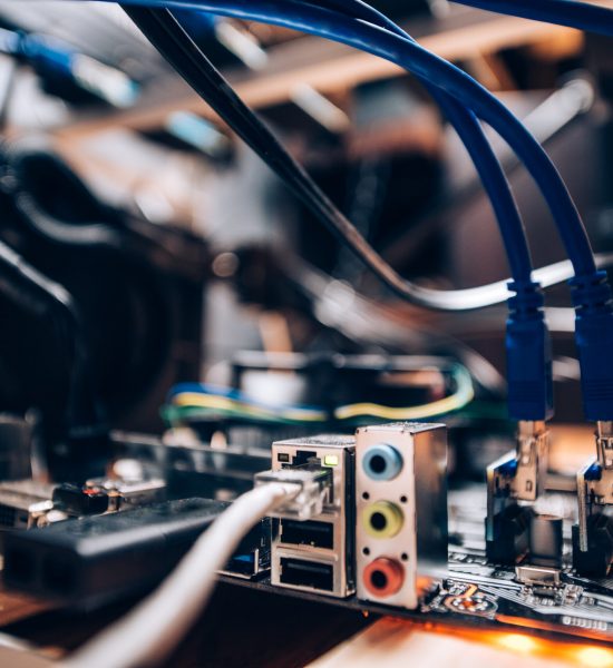 Close up details of mining rig, graphics cards cables and motherboard and network connecton. Modern technology used for mining bitcoin, ethereum and other alt coins